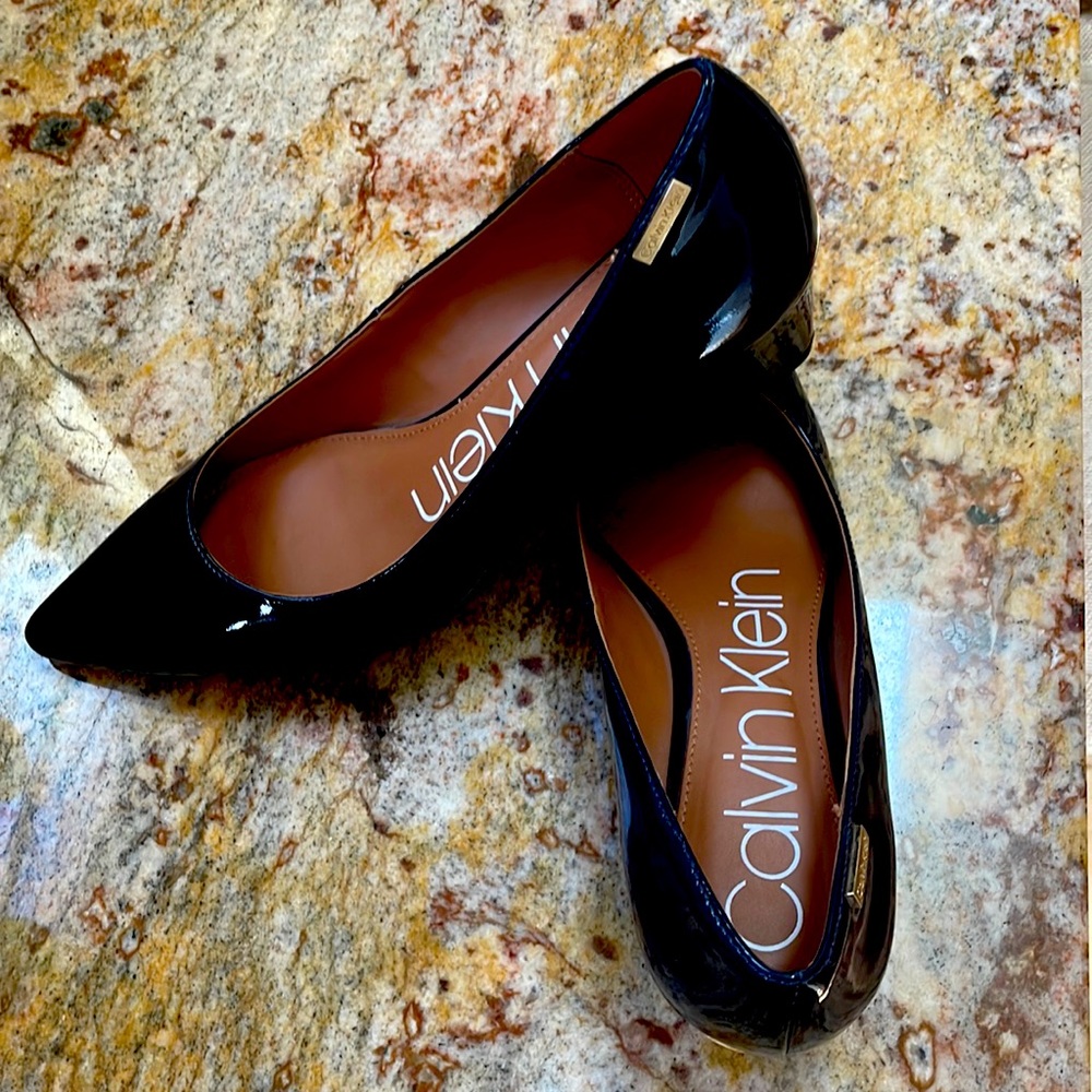 Size 7.5, wedge Calvin Klein heels. Never been worn. Brand new